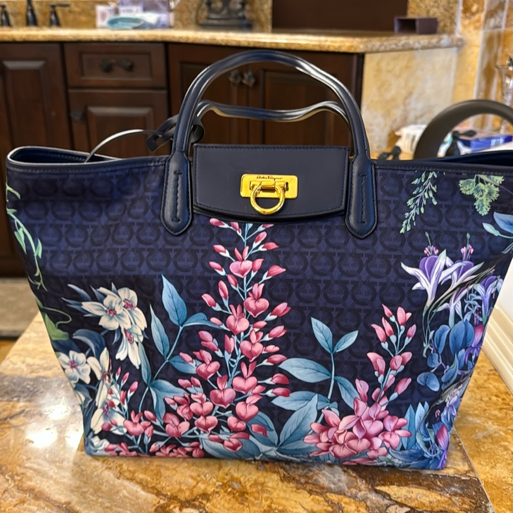 Navy blue Salvatore Ferragamo purse with zip purse included.
